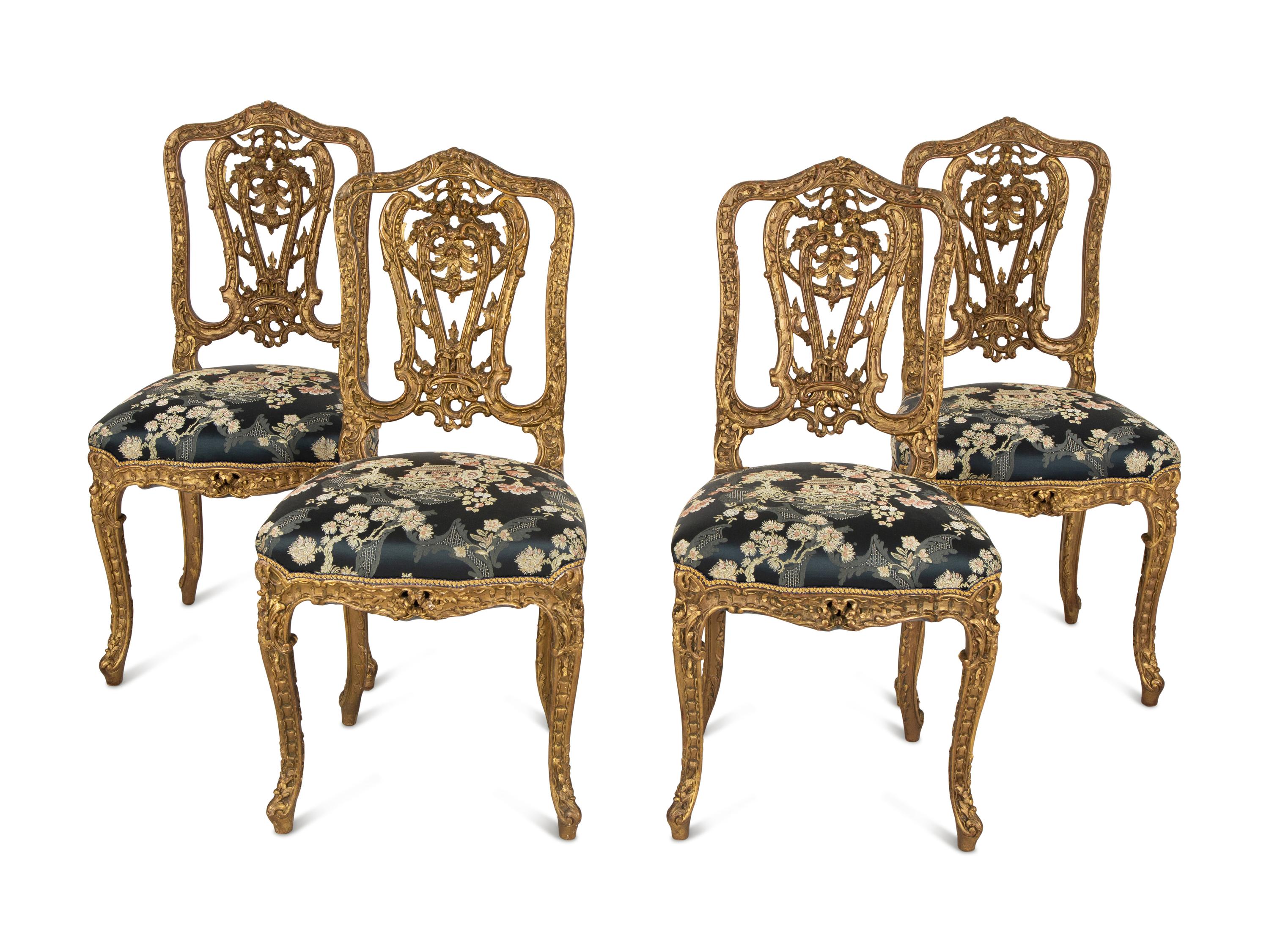 A Set of Four French Rococo Style Carved Gilt Wood Side Chairs