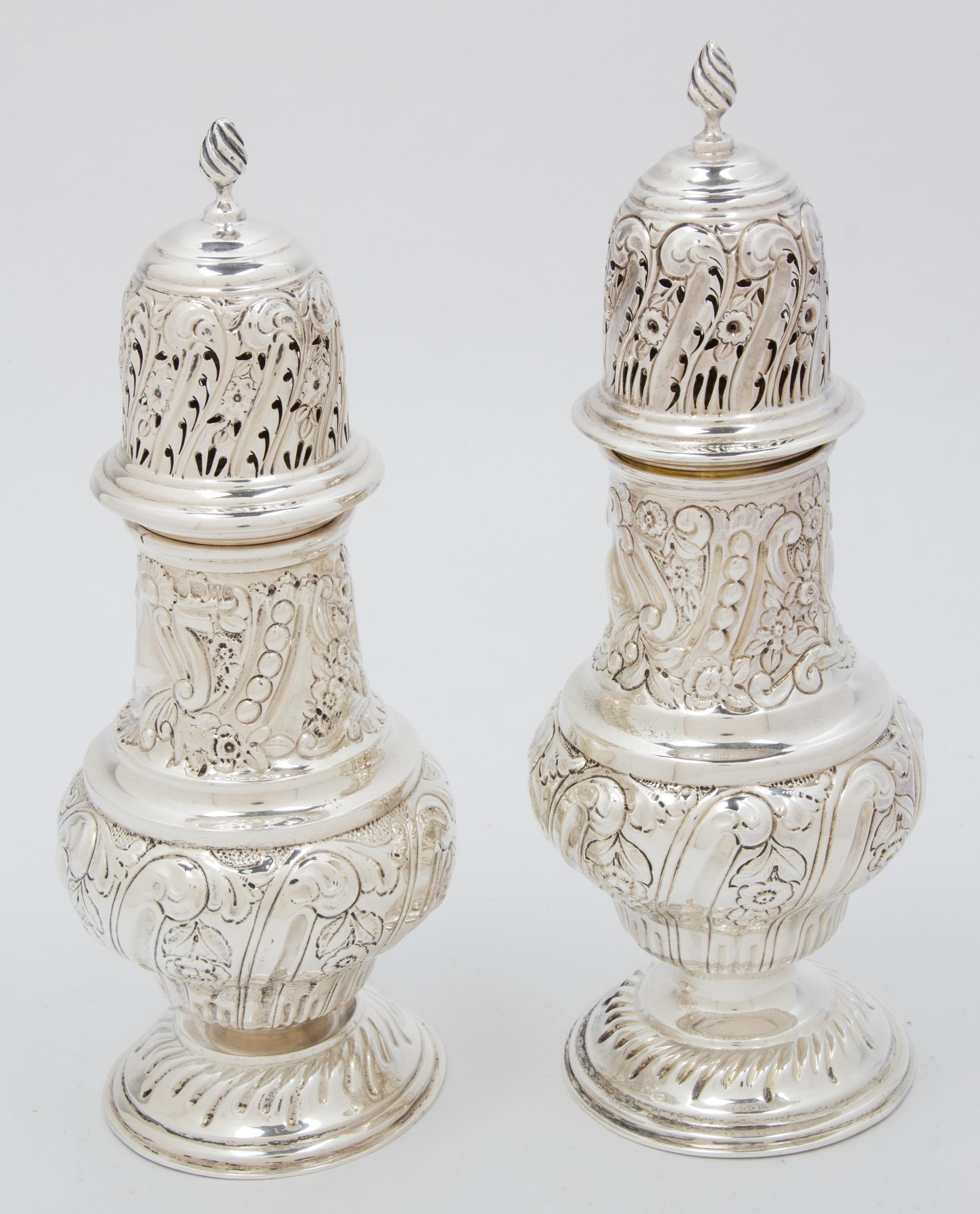 Two Victorian Silver Muffineers, George Nathan & Ridley Hayes, Chester, 1899, both of baluster form, chased with flowers and foliate sc