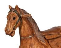 A Paint Decorated Rocking Horse and a Carved Rocking Horse