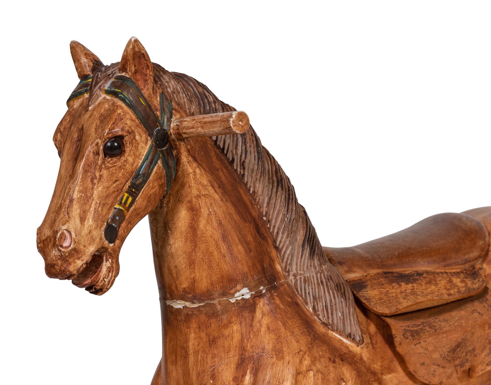 A Paint Decorated Rocking Horse and a Carved Rocking Horse