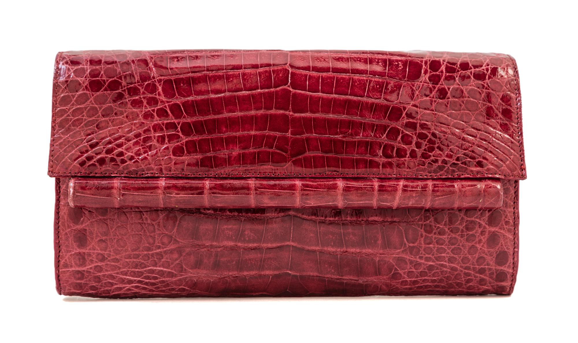 A Nancy Gonzalez Burgundy Columbian Crocodile Clutch, 8.75" x 4.75" x 1.25".