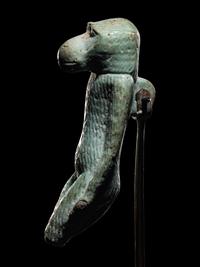 An Egyptian Faience Standing Ape