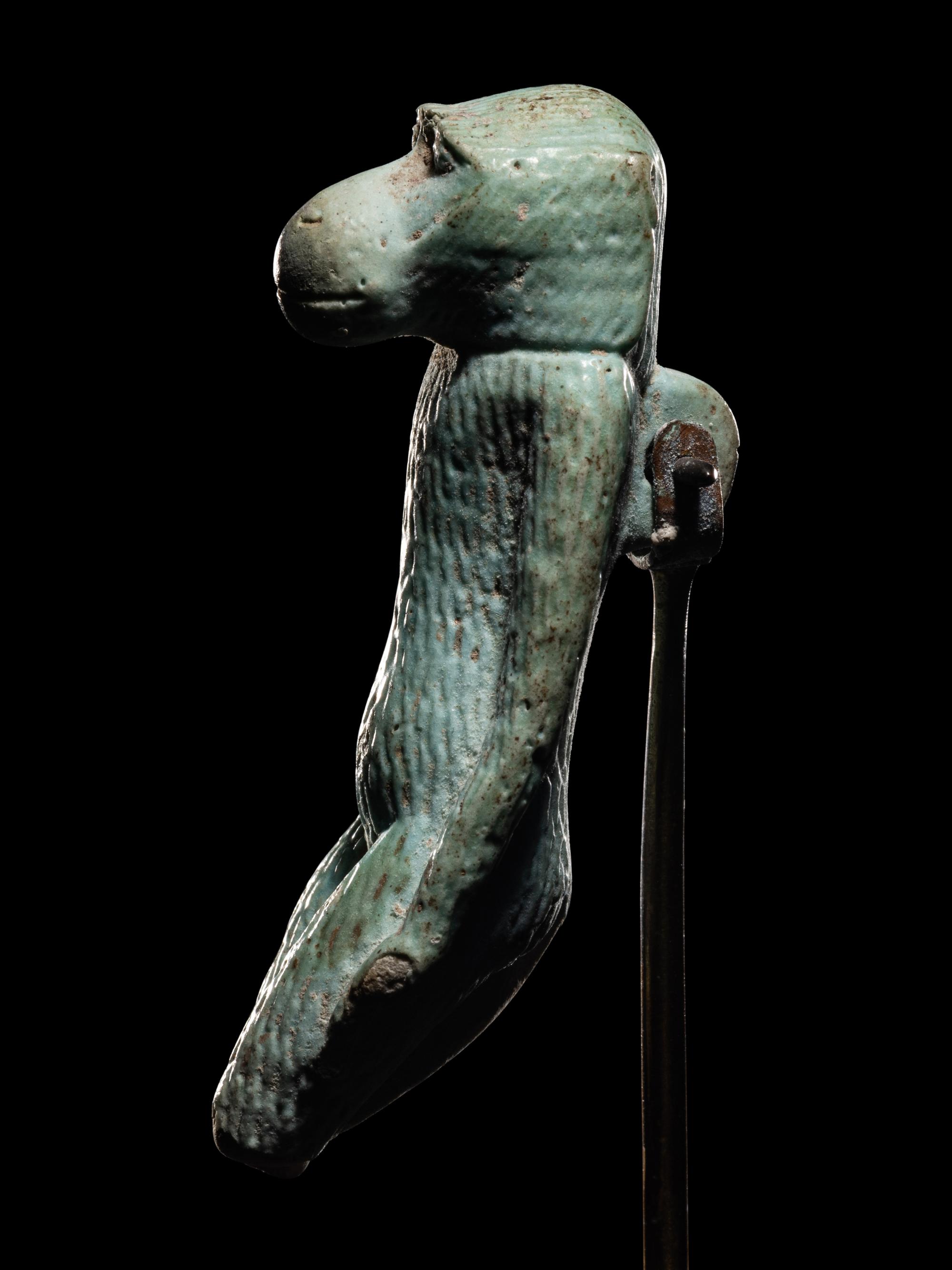 An Egyptian Faience Standing Ape