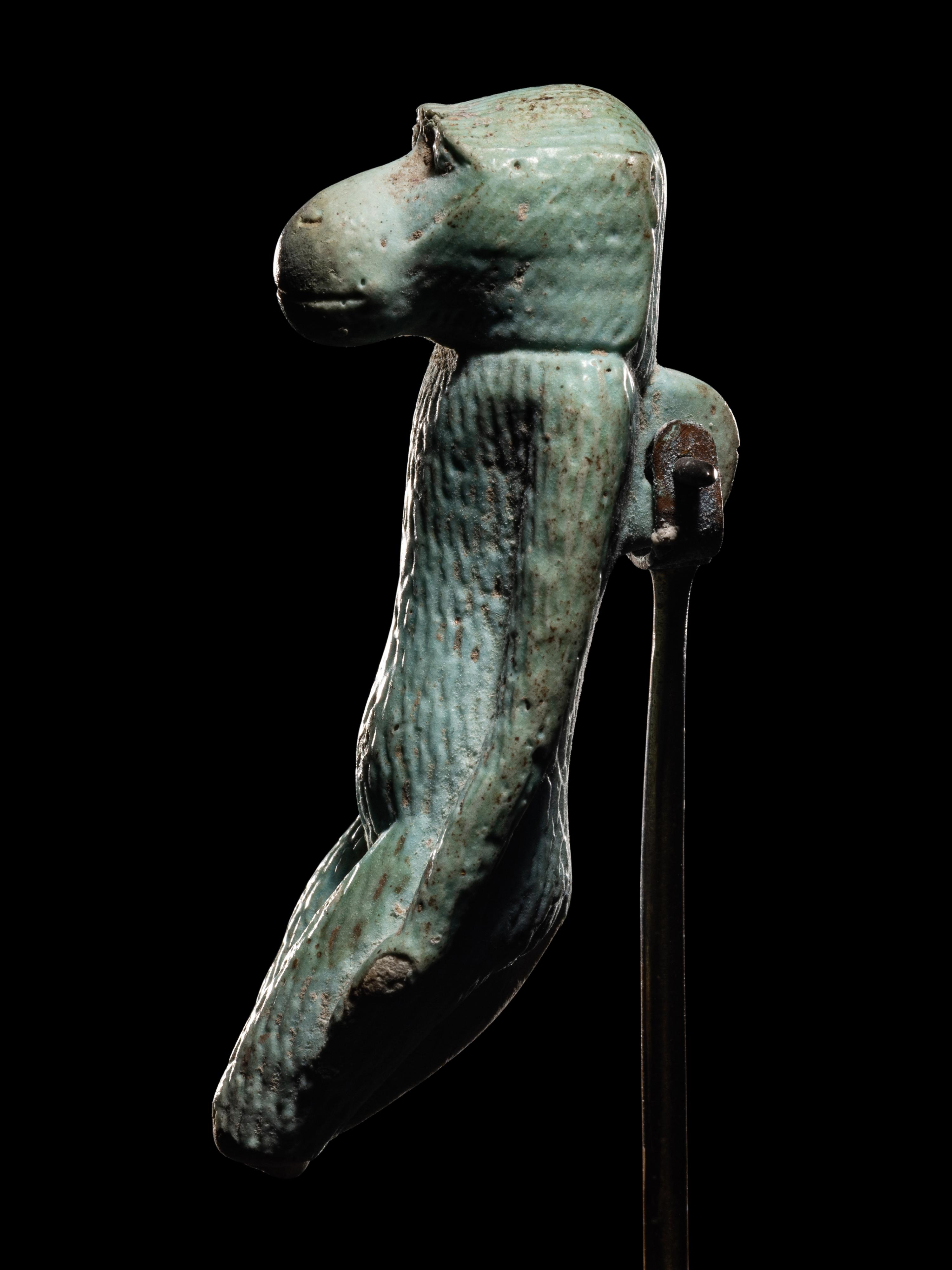 An Egyptian Faience Standing Ape