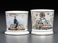 Two Cyclist's Porcelain Shaving Mugs