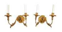 A Pair of Continental Giltwood Two-Light Sconces Width 13 inches. — 19TH CENTURY
