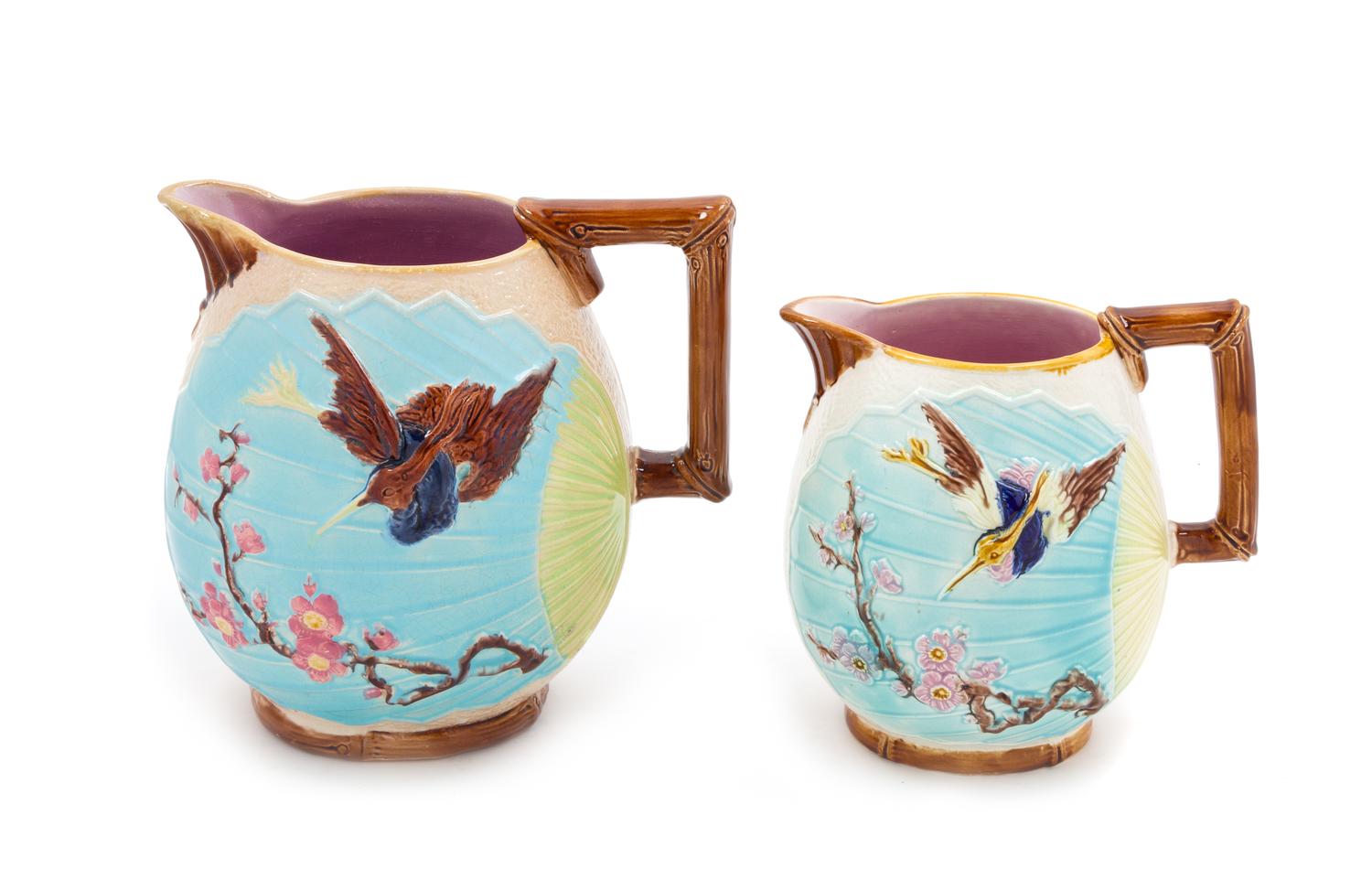 Two Majolica Water Pitchers Height of tallest 9 inches.
