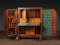 A Carved Walnut Wooton Secretary Desk