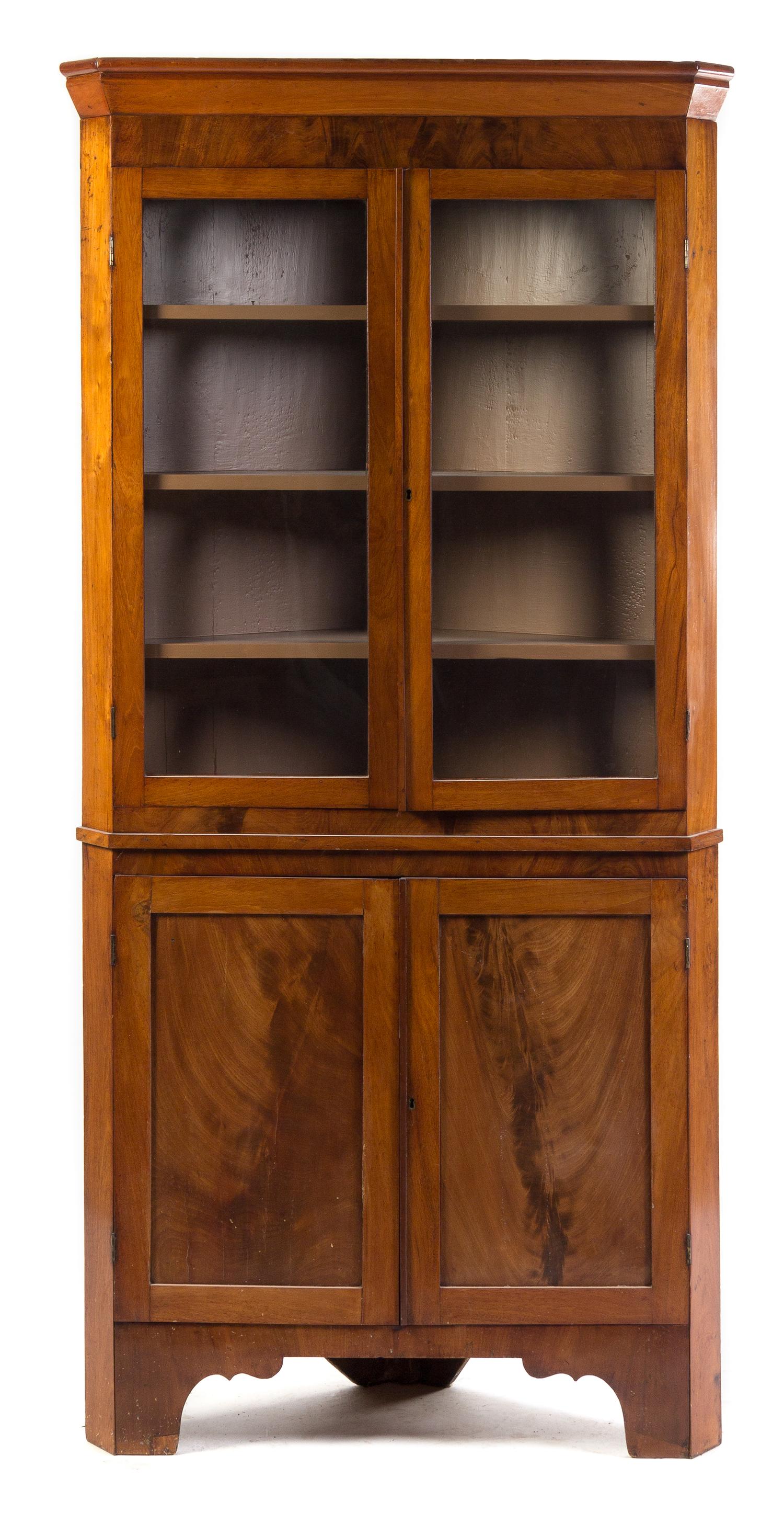 An American Mahogany Corner Cupboard Height 81 1/4 x width 40 x depth 17 inches.
