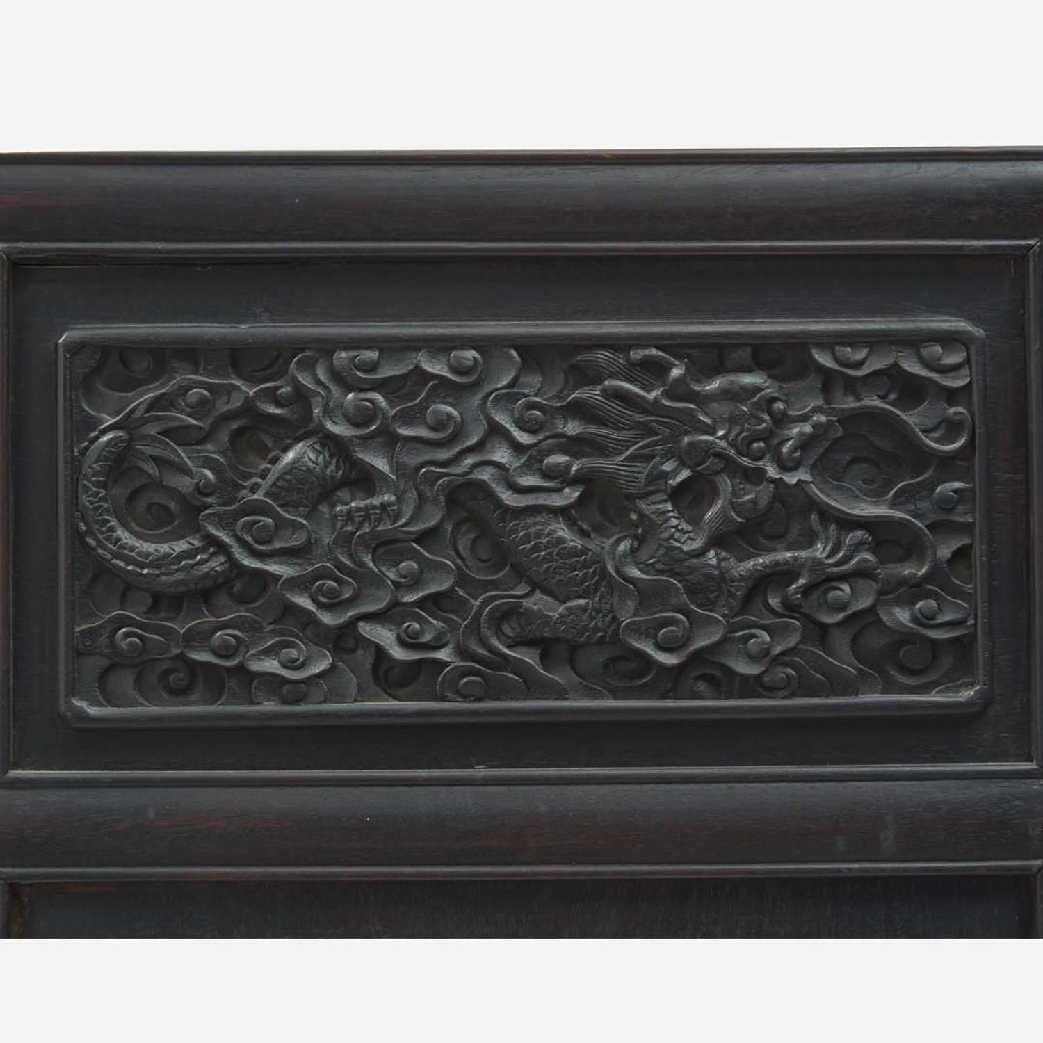 A Chinese carved hardwood six-panel “Dragons” screen 硬木浮雕龙纹六开屏风