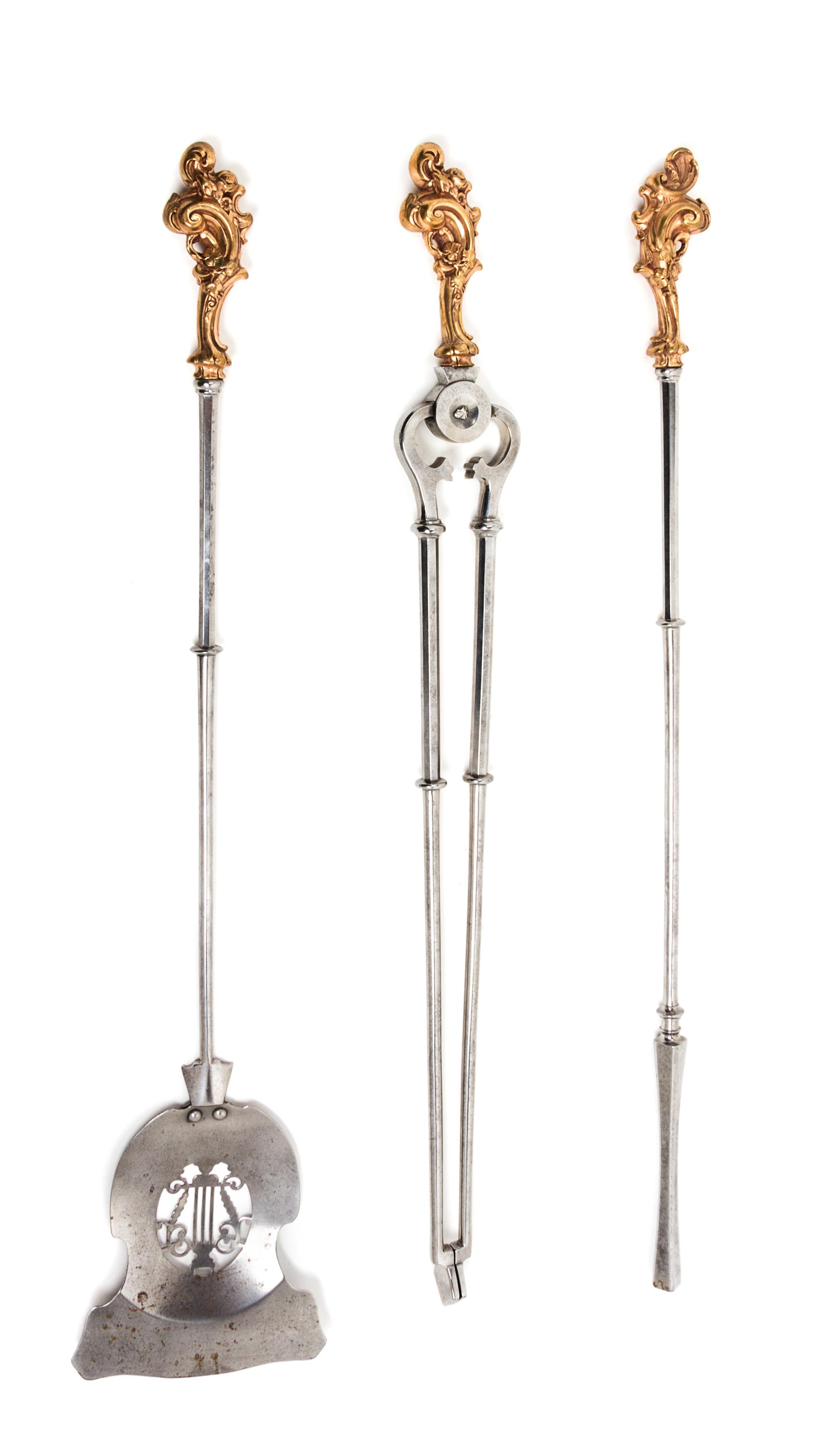 A Set of French Gilt Bronze and Steel Fireplace Tools Length of longest 31 inches. — 18TH CENTURY