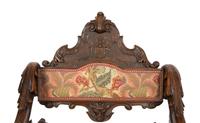 An Italian Carved Walnut Fantasy Rocking Chair