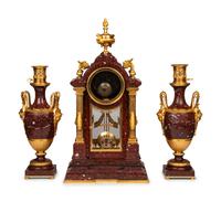 A Louis XVI Style Rouge Marble and Gilt Bronze Clock Garniture