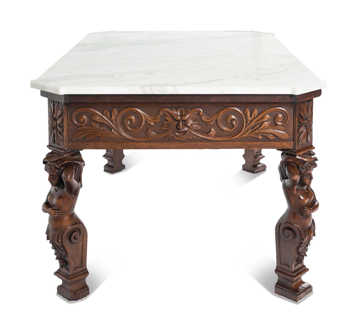 A Renaissance Style Carved Oak Marble-Top Low Table