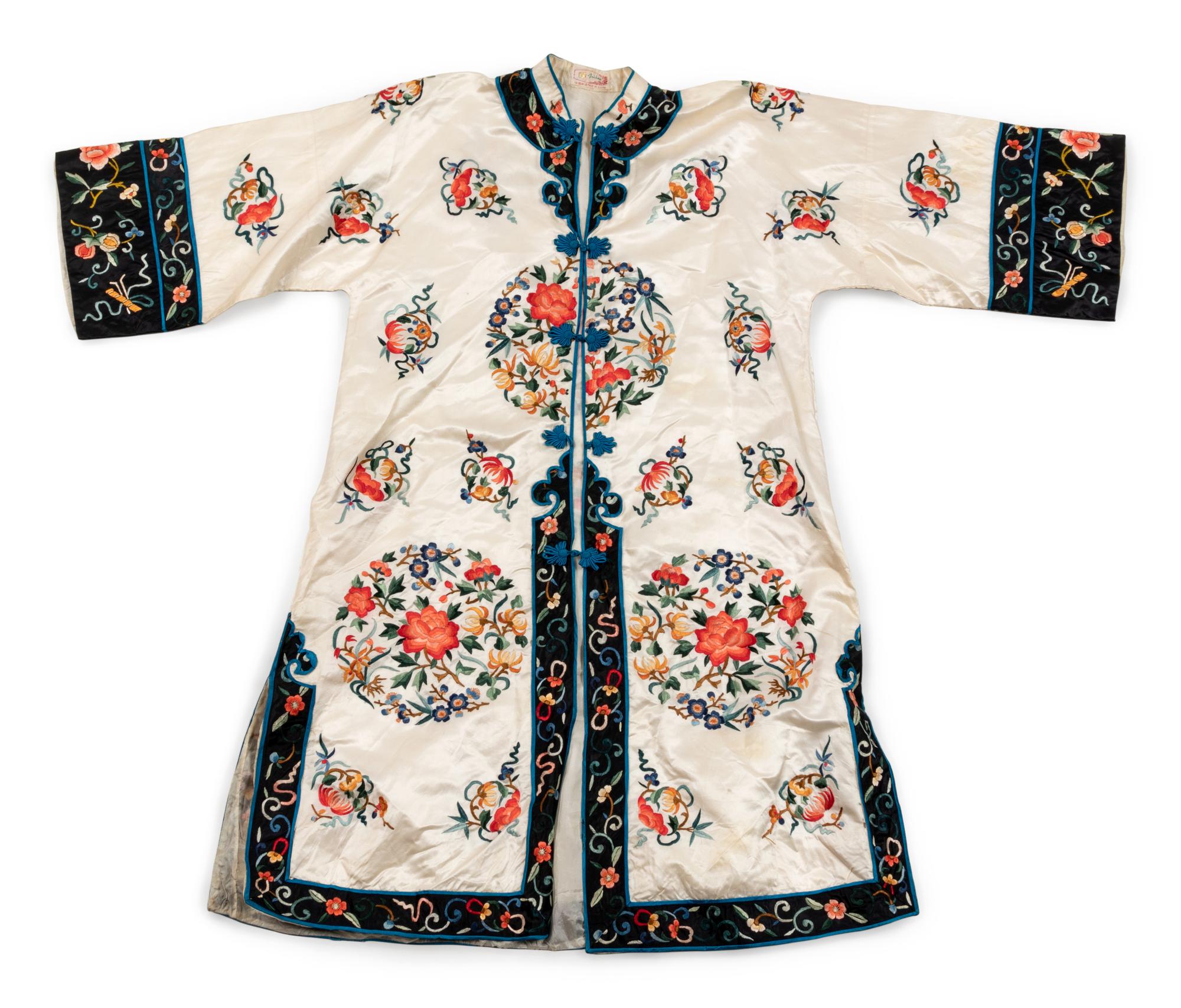 A Chinese White Ground Embroidered Silk Lady's Robe