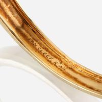 An eighteen karat gold and gem-set bangle, Van Cleef & Arpels