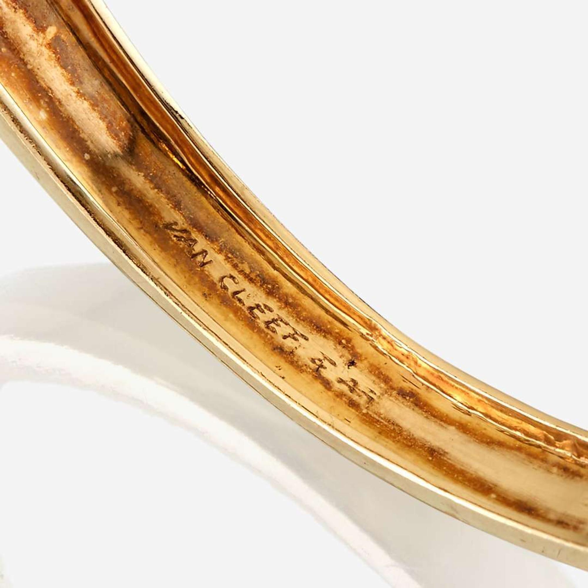 An eighteen karat gold and gem-set bangle, Van Cleef & Arpels