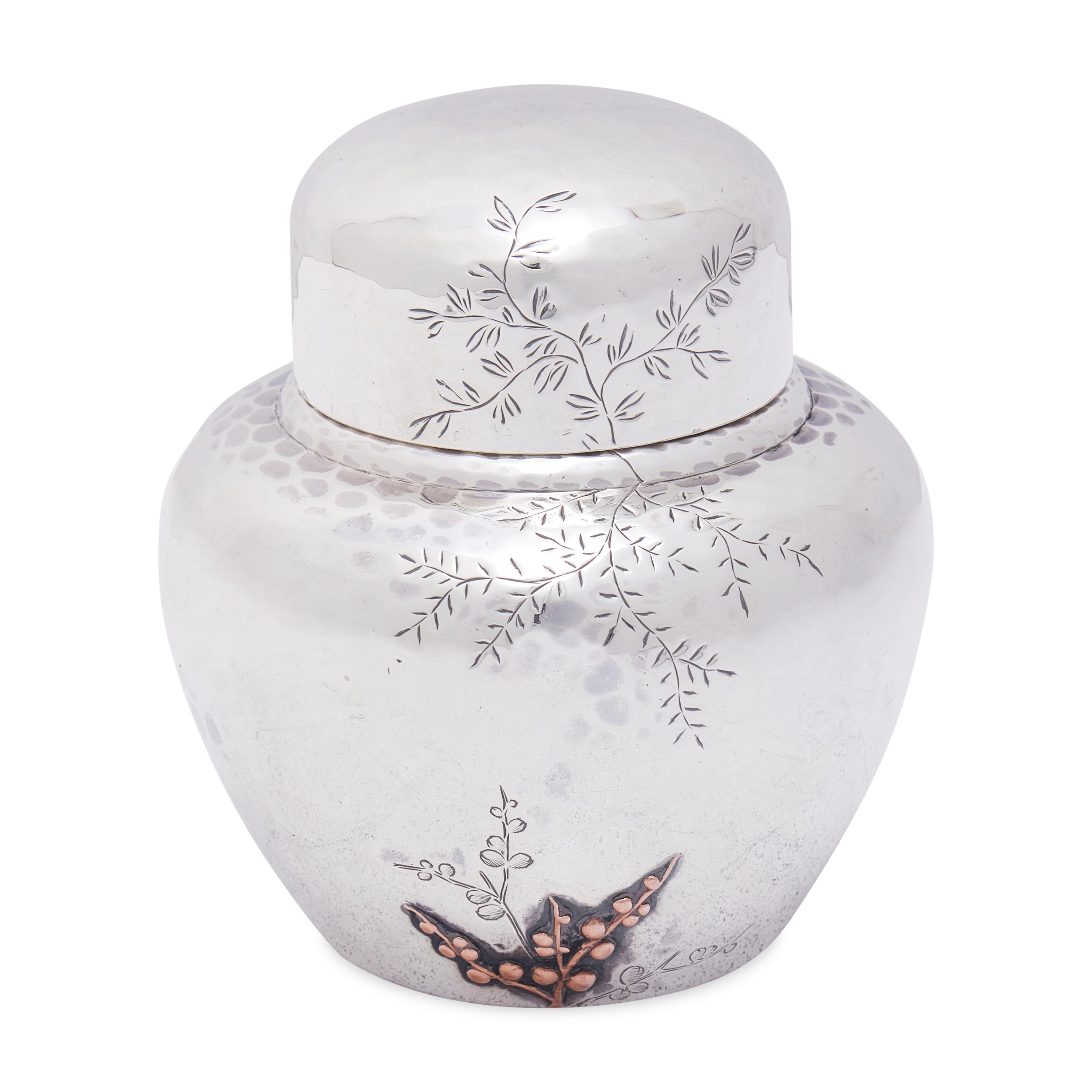 An Aesthetic Movement Japanesque Hammered Sterling Silver and Mixed Metal Tea Caddy
