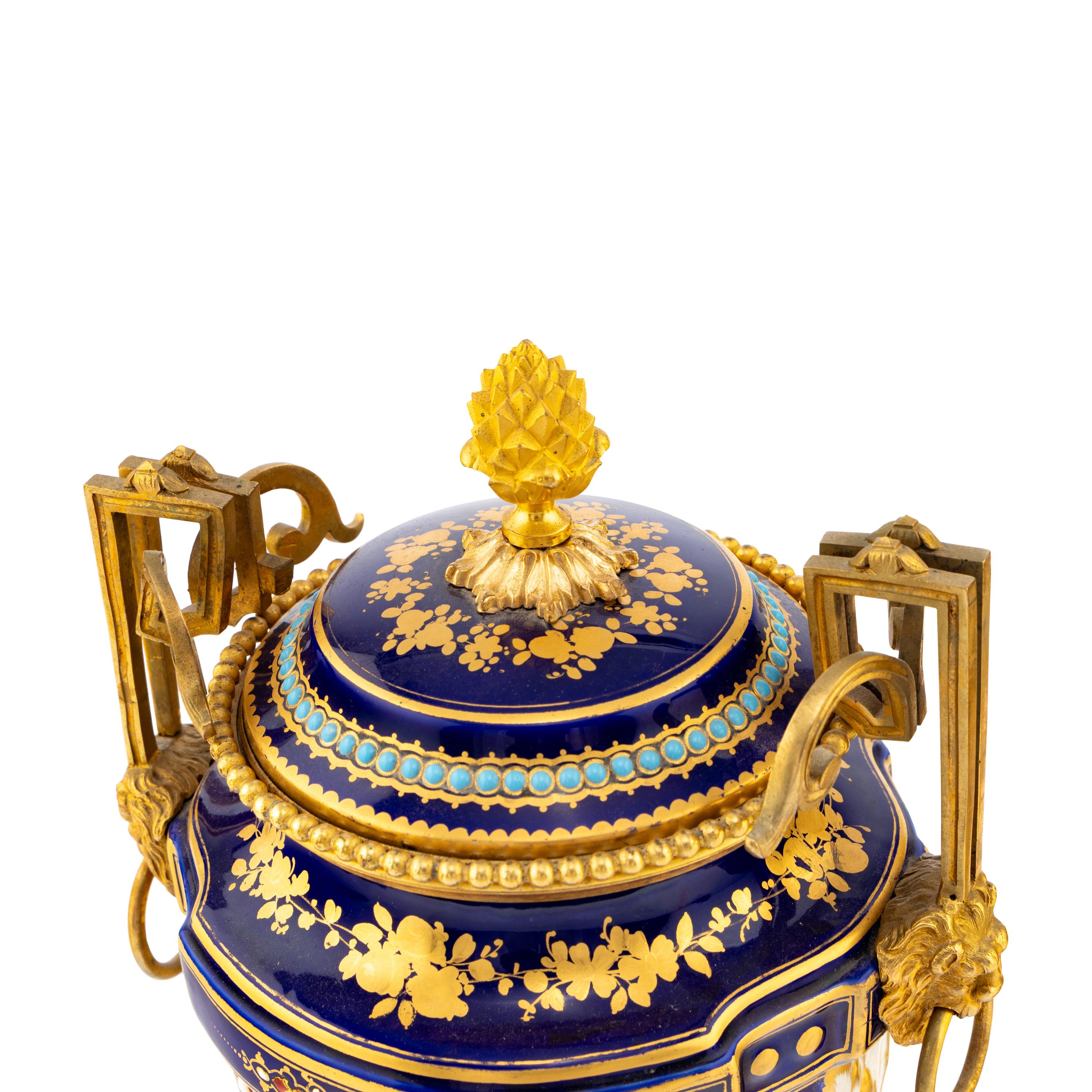 A Pair of Sèvres Style Porcelain, Enameled and Gilt Bronze Mounted Urns