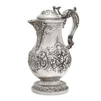 A Belgian Repoussé Silver Ewer
