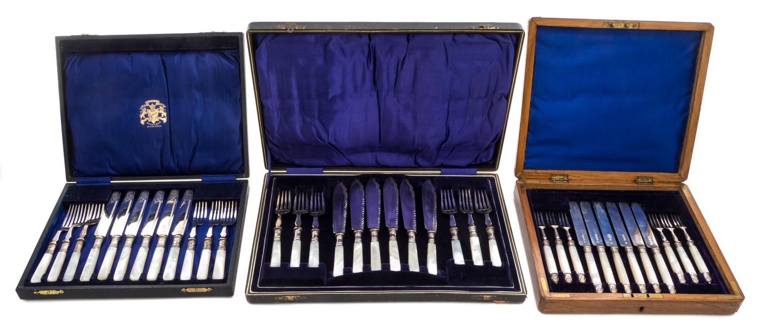 Three Cased Flatware Sets Length of longest knife 7 3/4 inches.