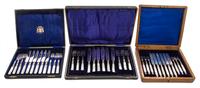 Three Cased Flatware Sets Length of longest knife 7 3/4 inches.