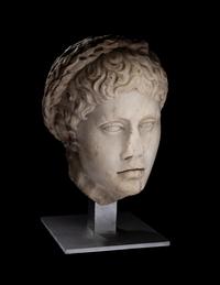A Roman Marble Head of a Youth Wearing a Laurel Wreath