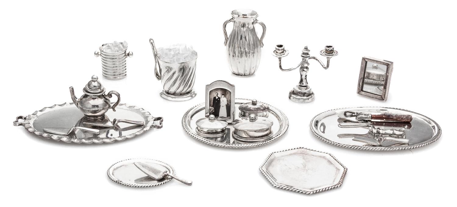 A Collection of Silver Table Articles, Enrique Quintanar, comprising five serving trays, three table caskets, a lobed water pitcher, a