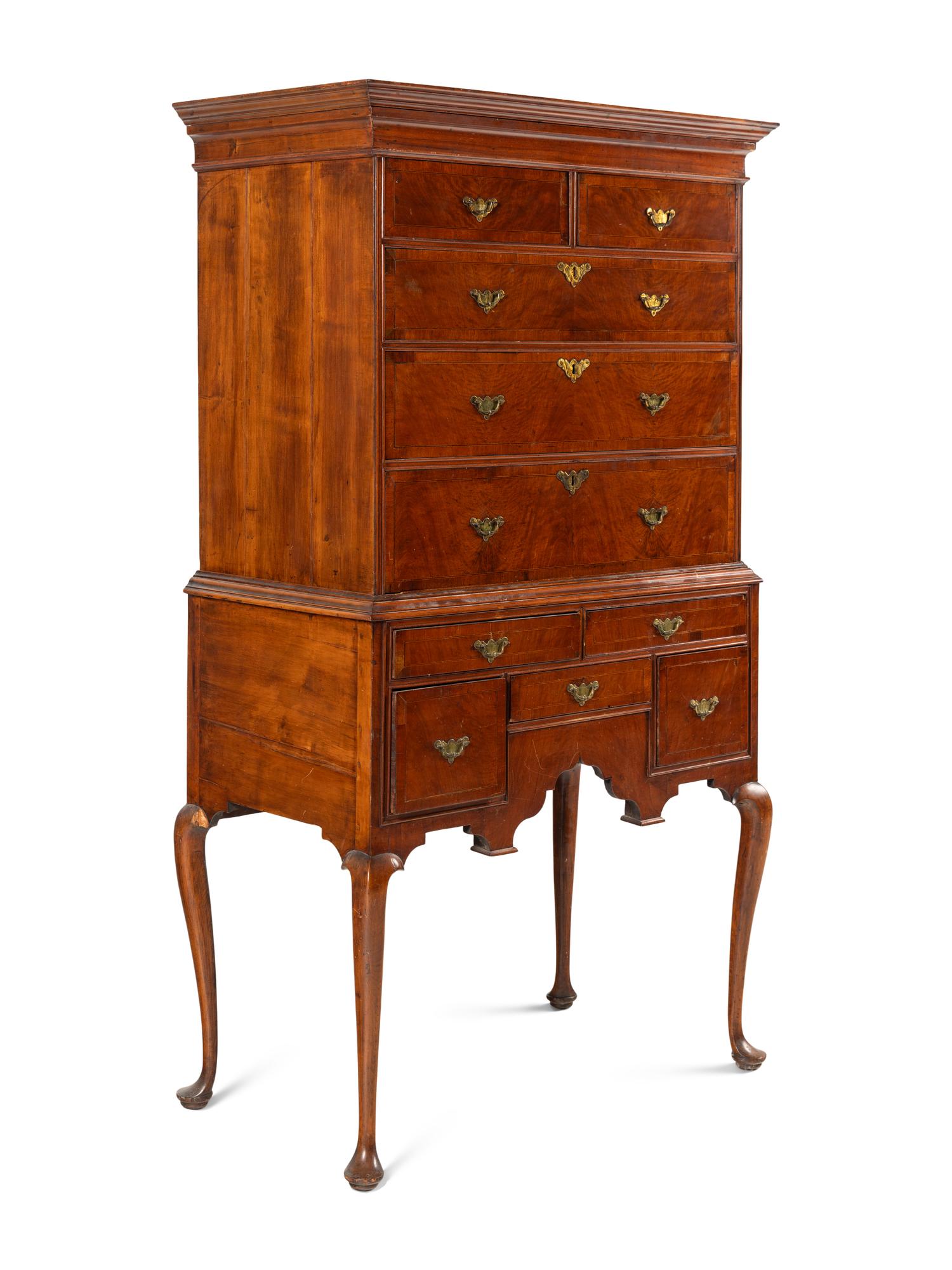 A Queen Anne Figured and Veneered Walnut Flat-Top High Chest Of Drawers