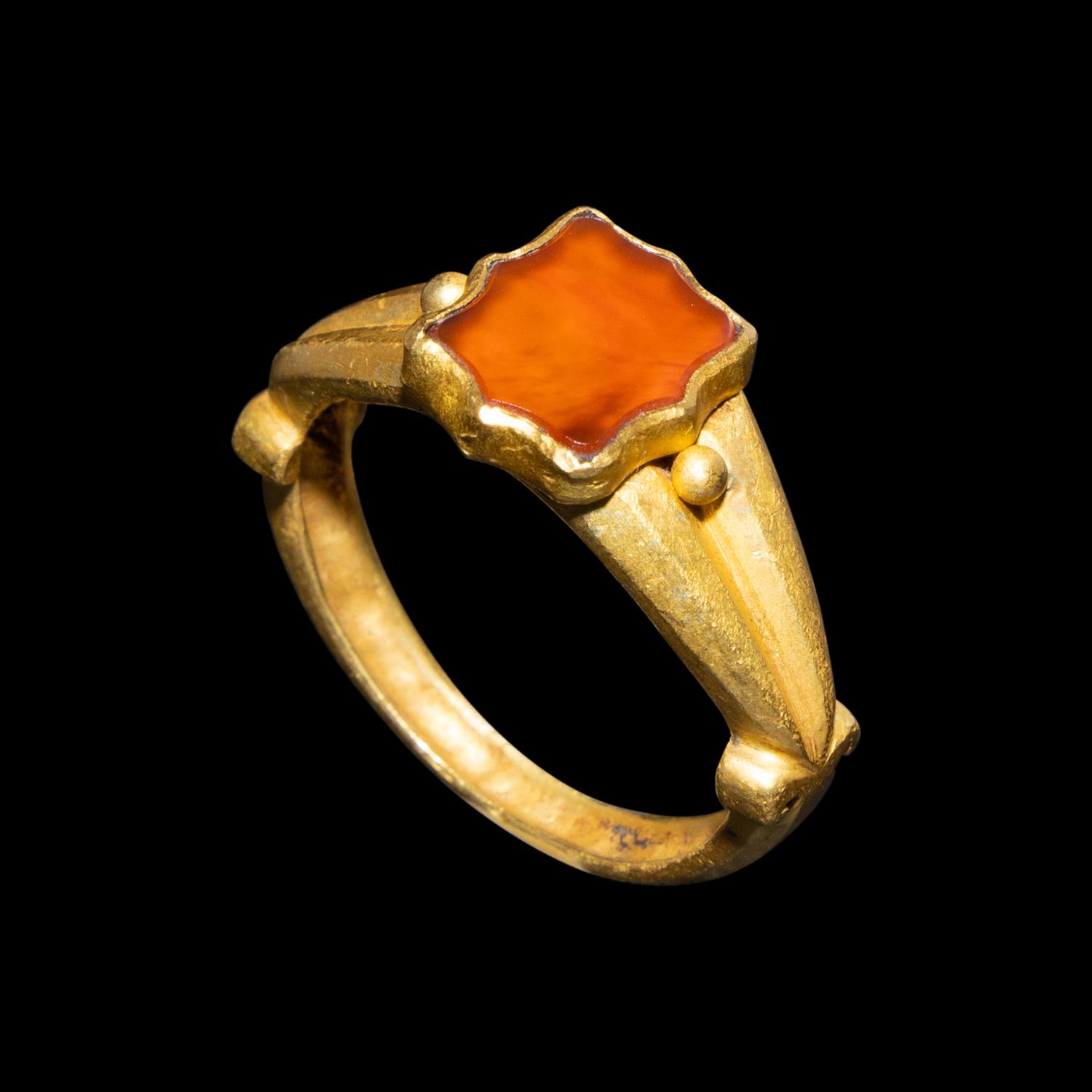 A Migration Period Gold and Spessartine Garnet Ring