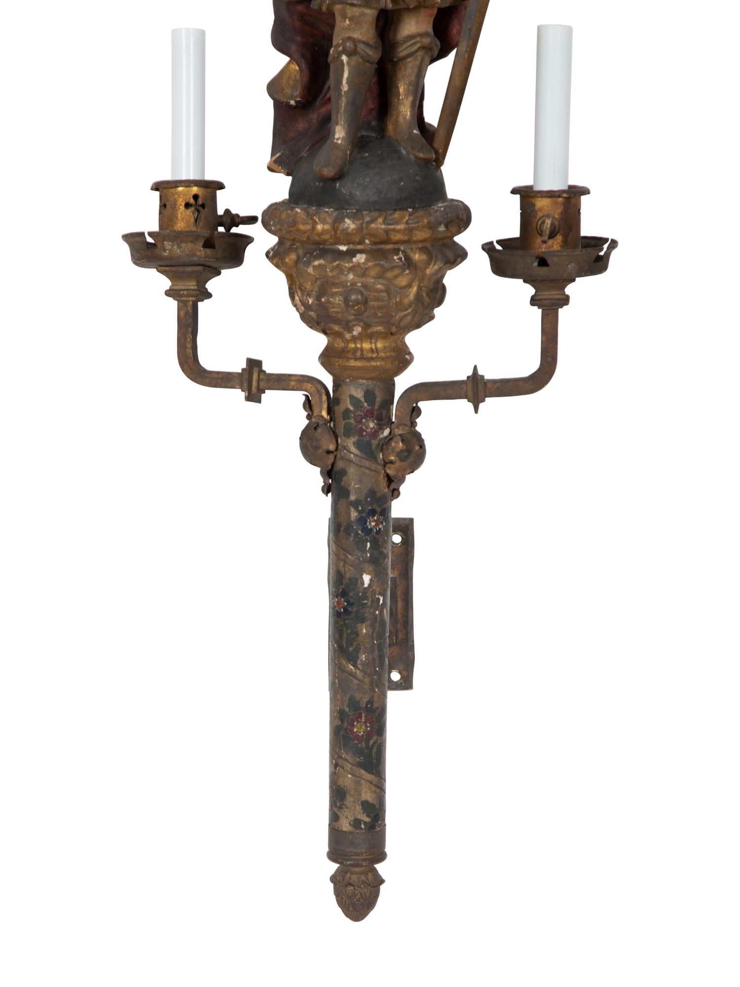 A Near Pair of Italian Carved Wood Figural Two-Light Sconces with Iron Mounts