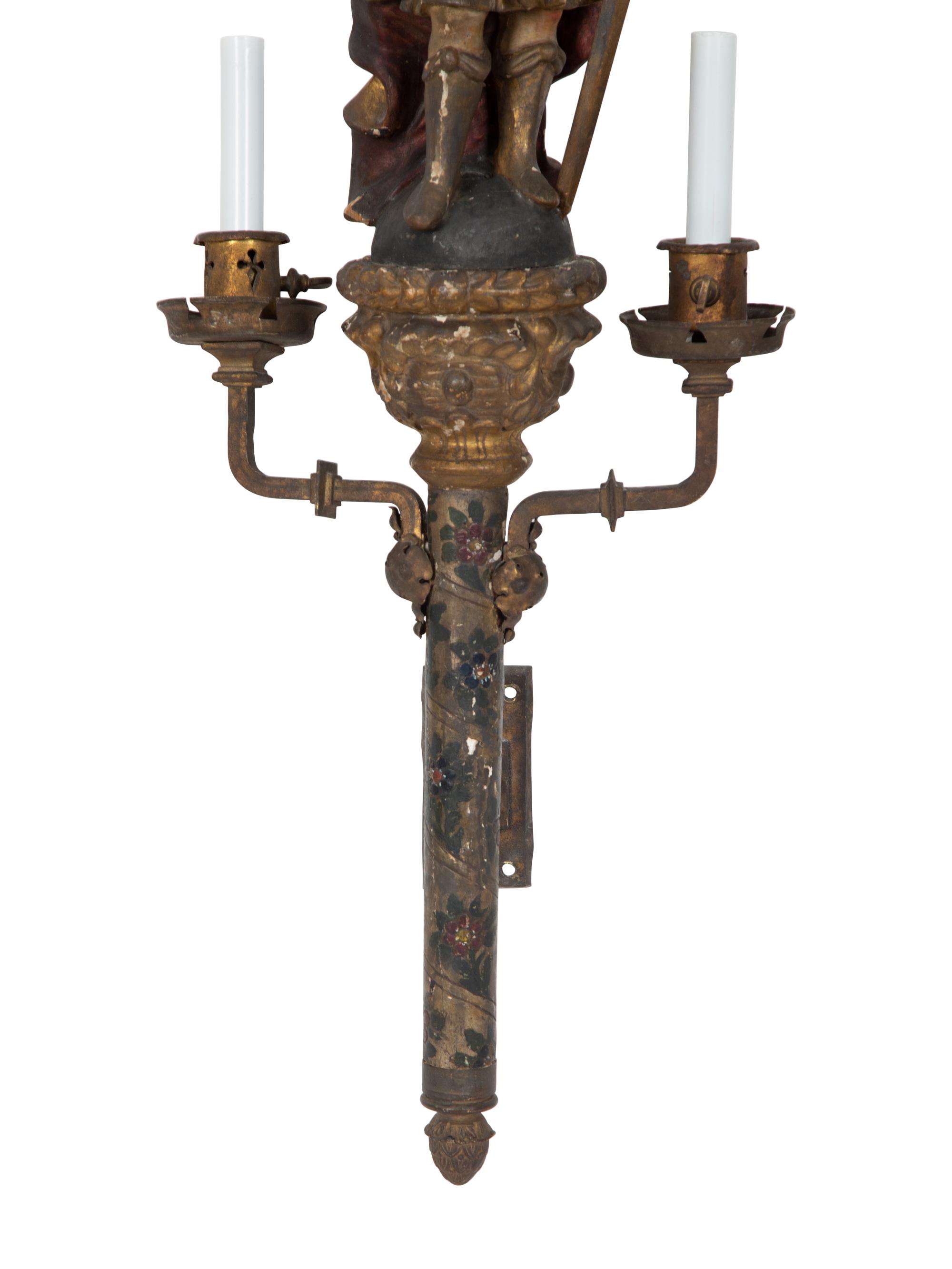 A Near Pair of Italian Carved Wood Figural Two-Light Sconces with Iron Mounts