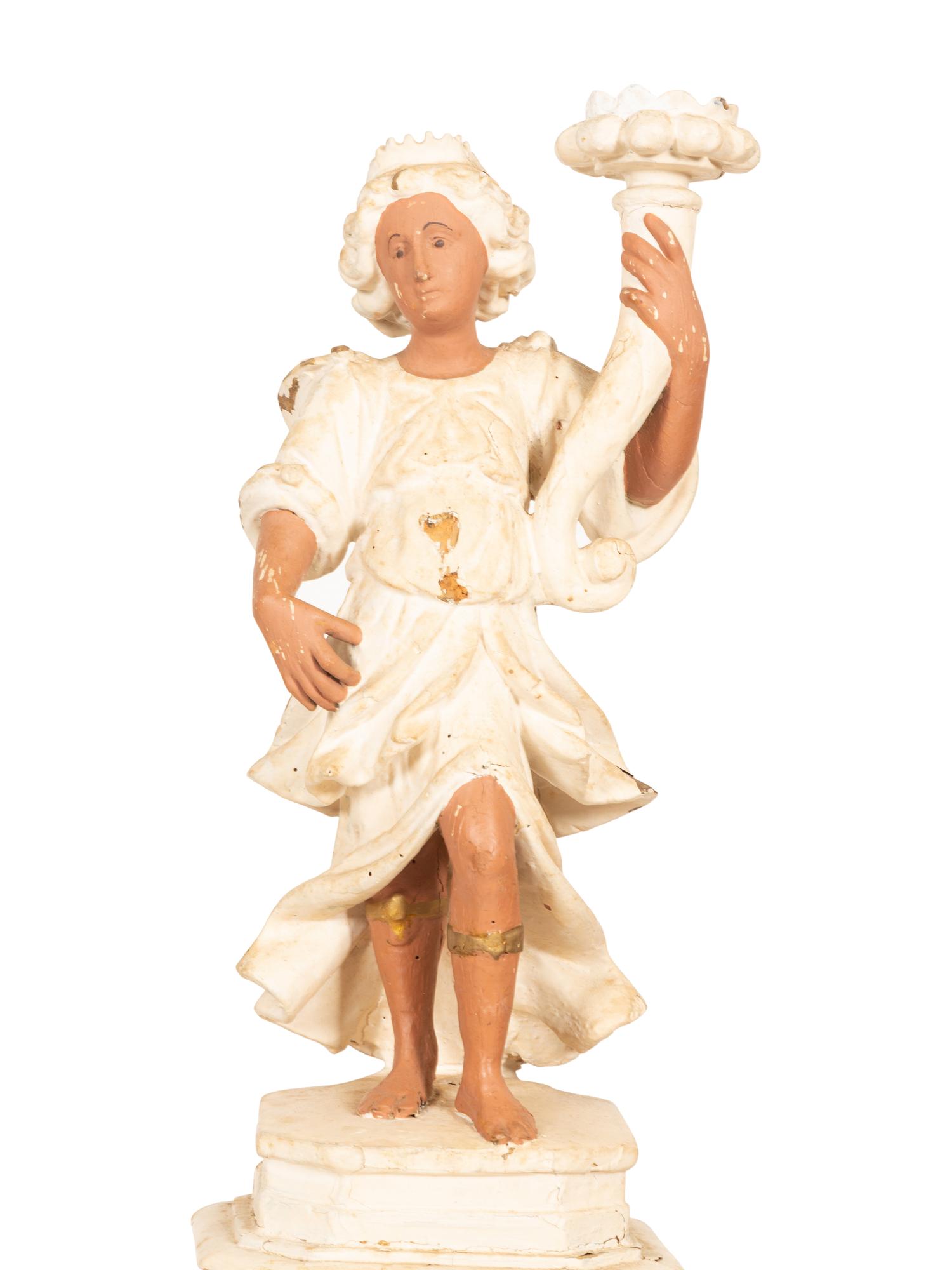 A Pair of Italian Painted Figural Candelsticks on Pedestal Bases