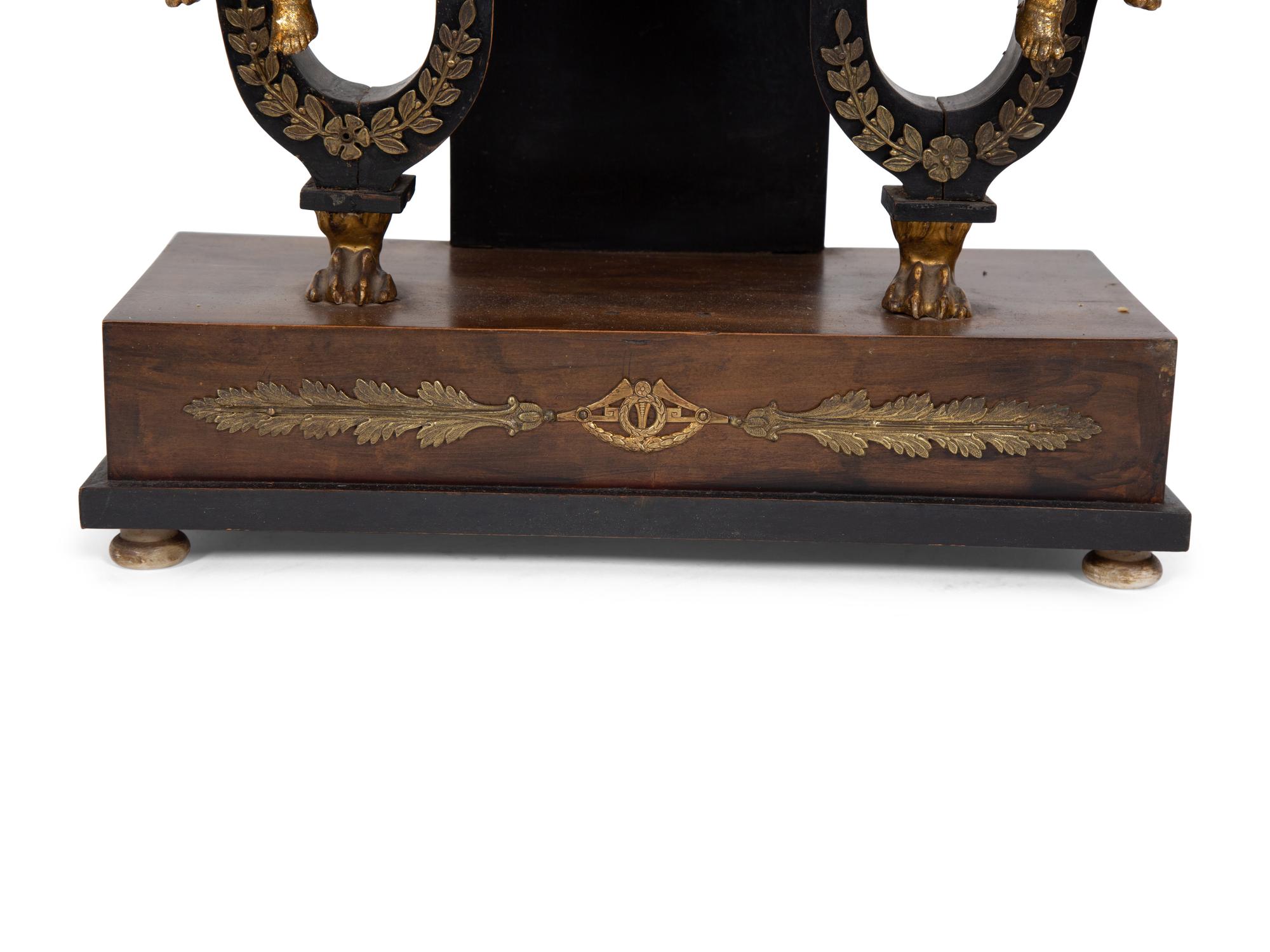 An Austrian Ebonized and Burlwood Mantel Clock with Gilt Metal and Giltwood Mounts