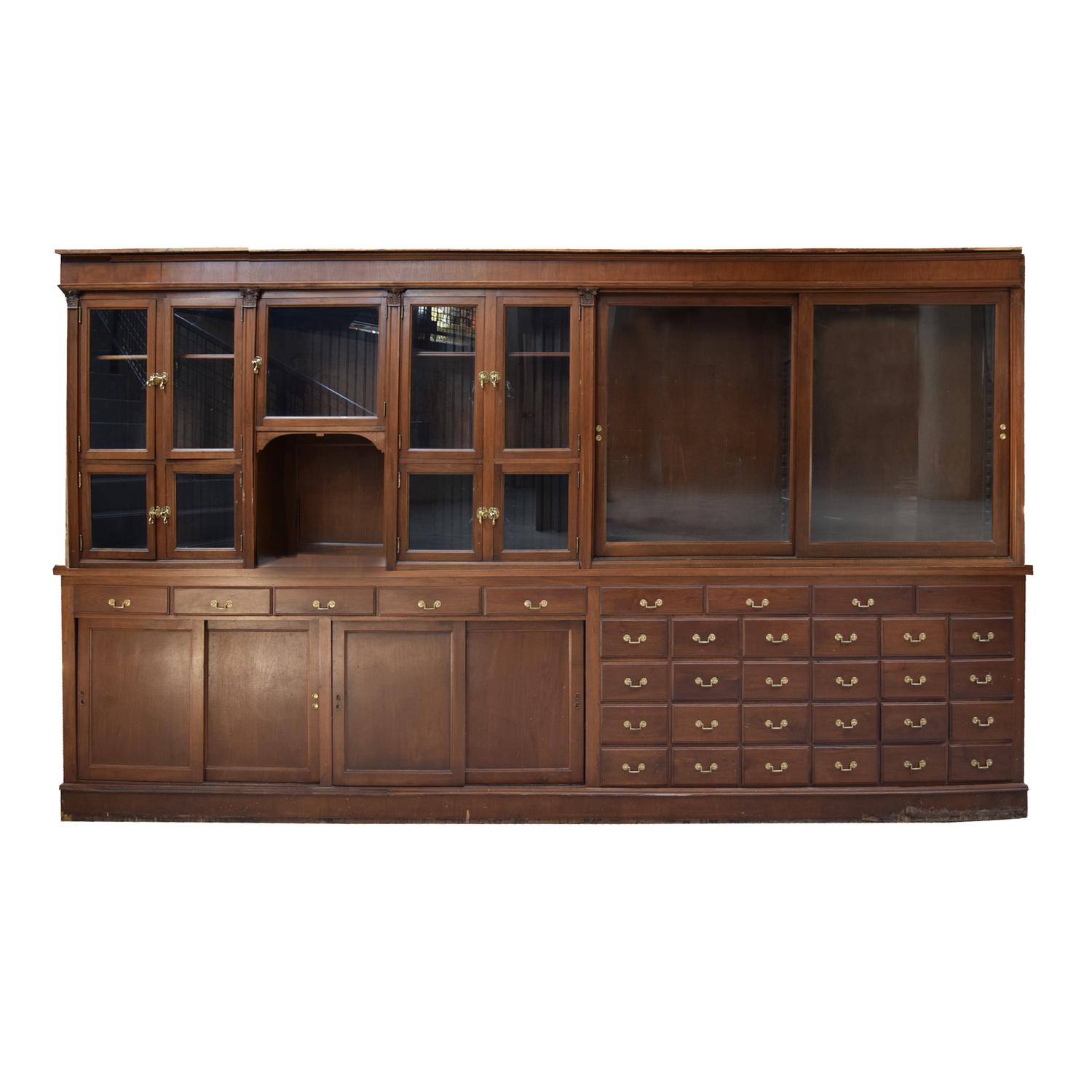 A Two-Tier Mahogany Pharmacy Cabinet 165" W x 15" D x 95" H — United States, 20th Century