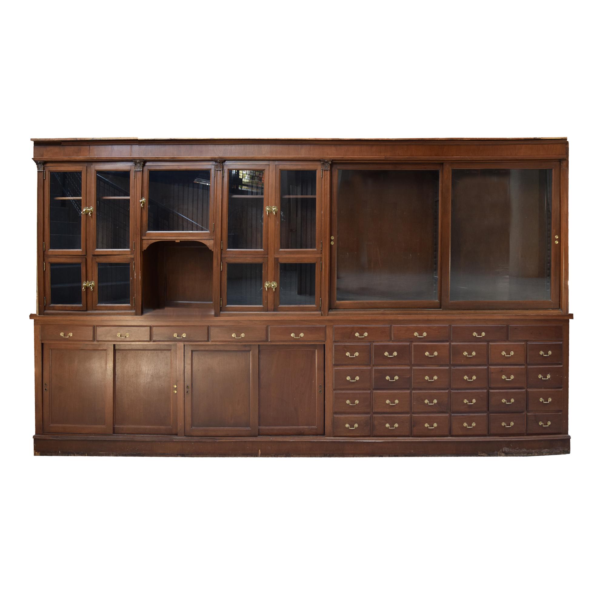 A Two-Tier Mahogany Pharmacy Cabinet 165" W x 15" D x 95" H — United States, 20th Century