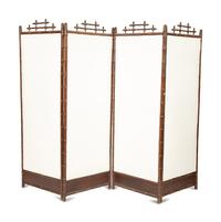 A Victorian Carved Mahogany and Parcel Gilt Faux-Bamboo Upholstered Four-Panel Screen