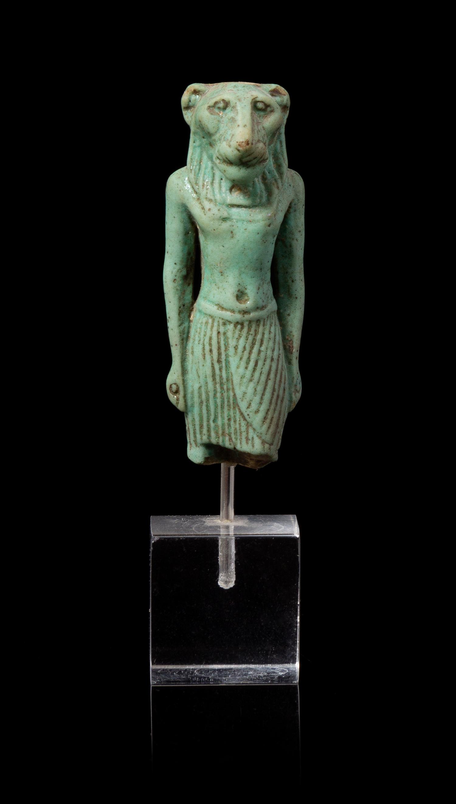 An Egyptian Faience Amulet of Mahes Height 2 1/4 inches. — LATE PERIOD TO PTOLEMAIC PERIOD, 664-30 B.C.E.
