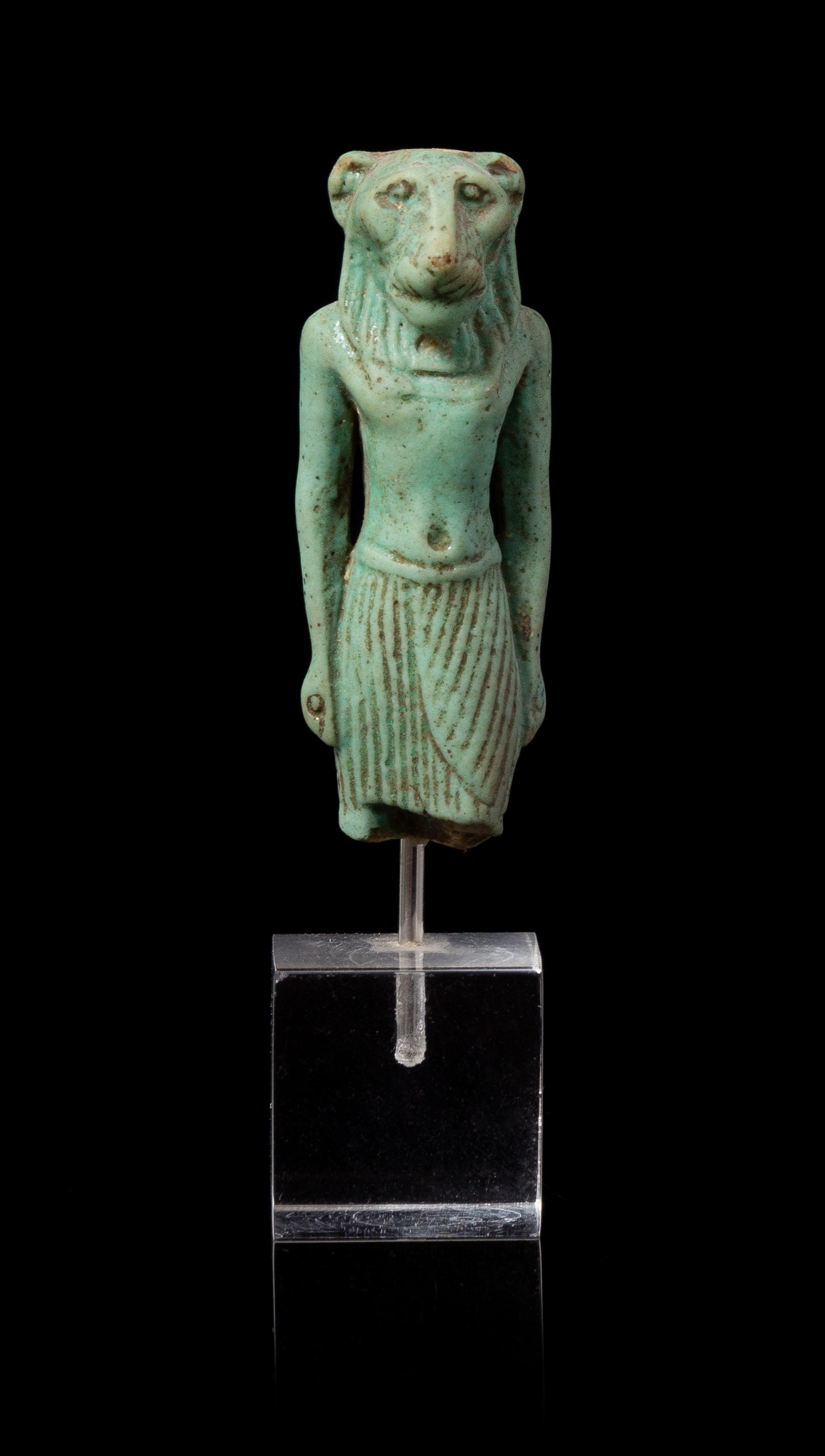 An Egyptian Faience Amulet of Mahes Height 2 1/4 inches. — LATE PERIOD TO PTOLEMAIC PERIOD, 664-30 B.C.E.