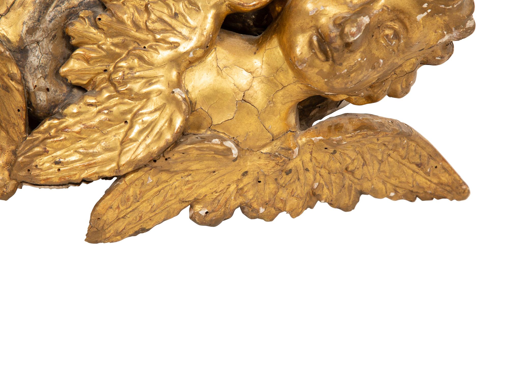 An Italian Carved Giltwood and Silvered Wall Mount