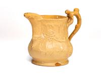 A Large Swan Hill Pottery Molded Yellowware Ice Water Pitcher