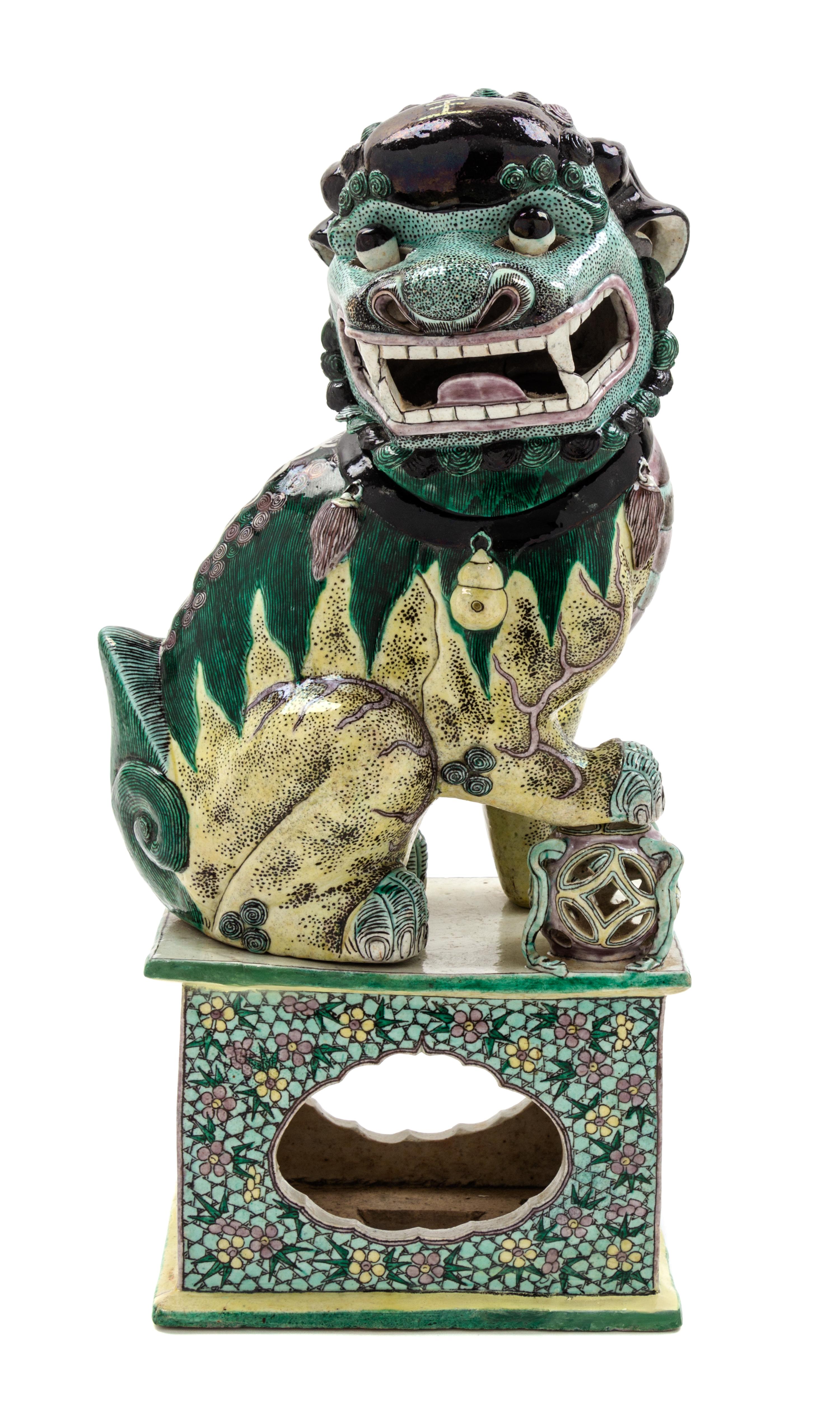 A Chinese Famille Verte Porcelain Seated Fu Dog Height overall 19 1/2 inches. — 19TH CENTURY