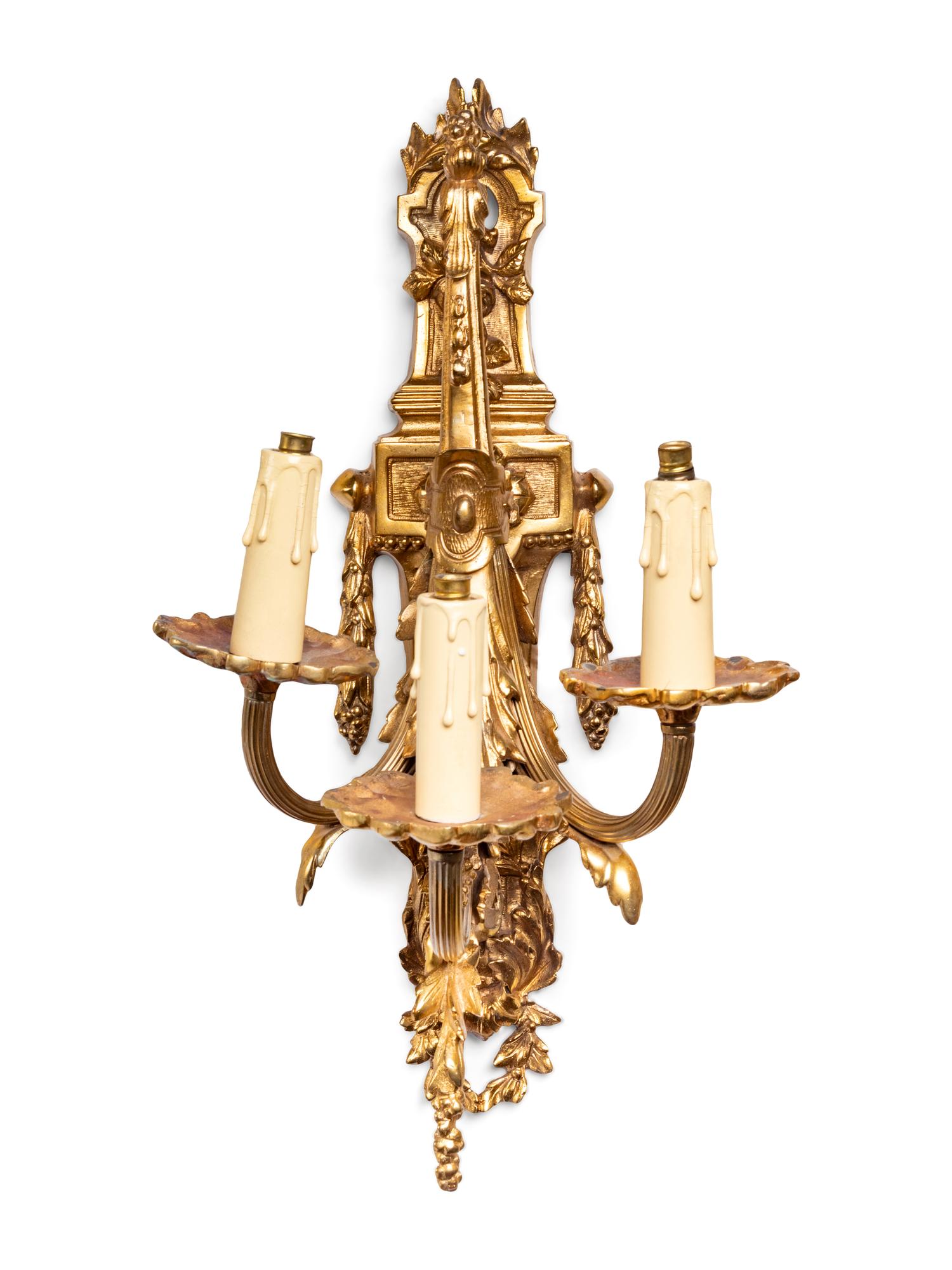 A Pair of Neoclassical Gilt Bronze Three-Light Sconces