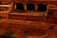 An Austrian Crossbanded Burl Walnut Slant-Front Bureau