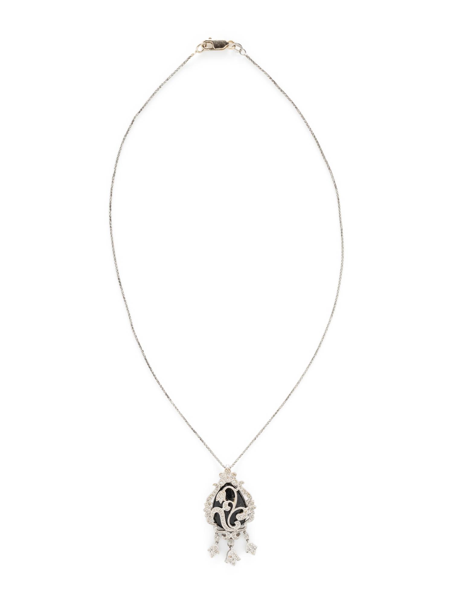 WHITE GOLD, DIAMOND, AND BLACK HARDSTONE DEMI PARURE