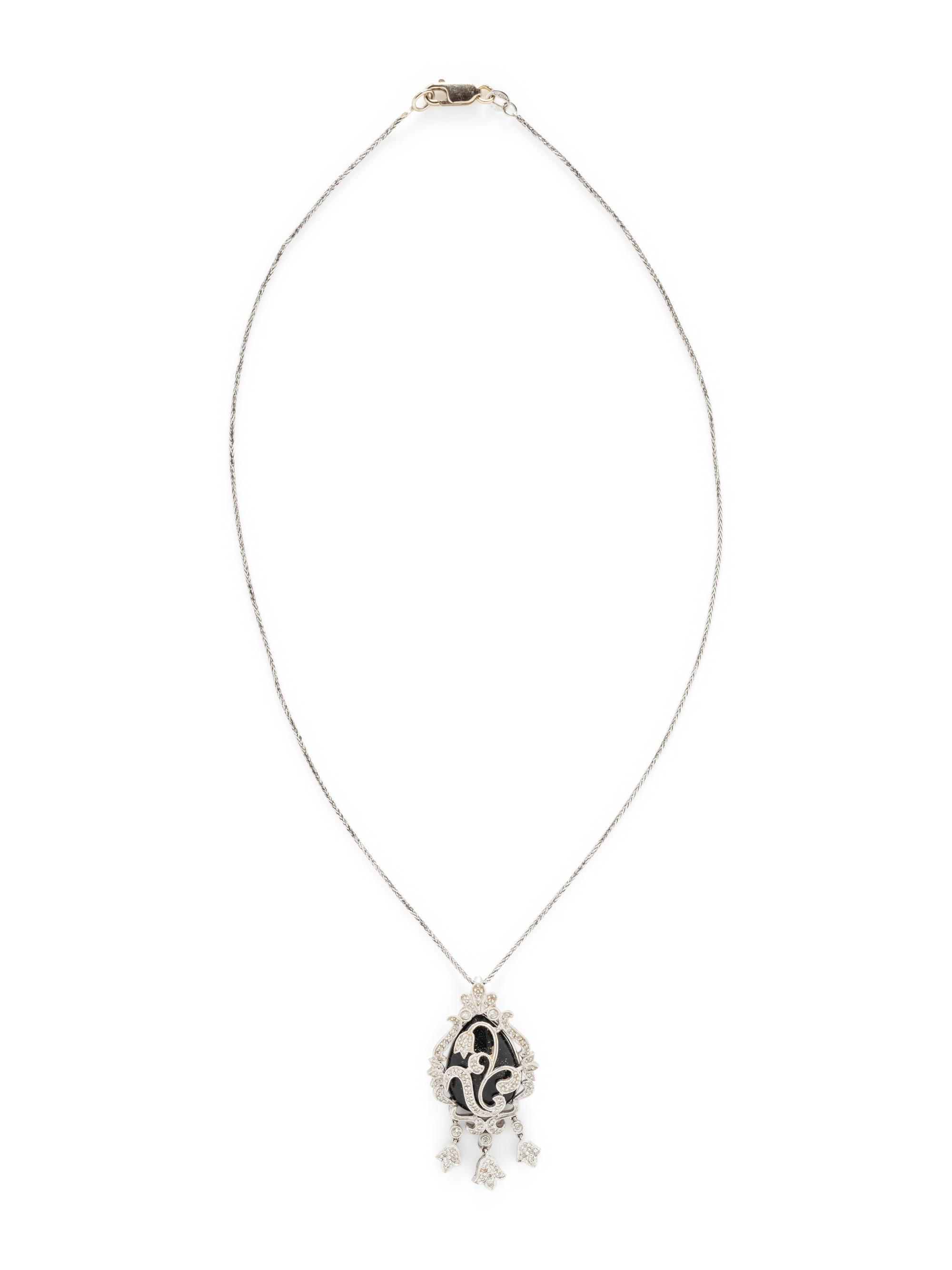 WHITE GOLD, DIAMOND, AND BLACK HARDSTONE DEMI PARURE