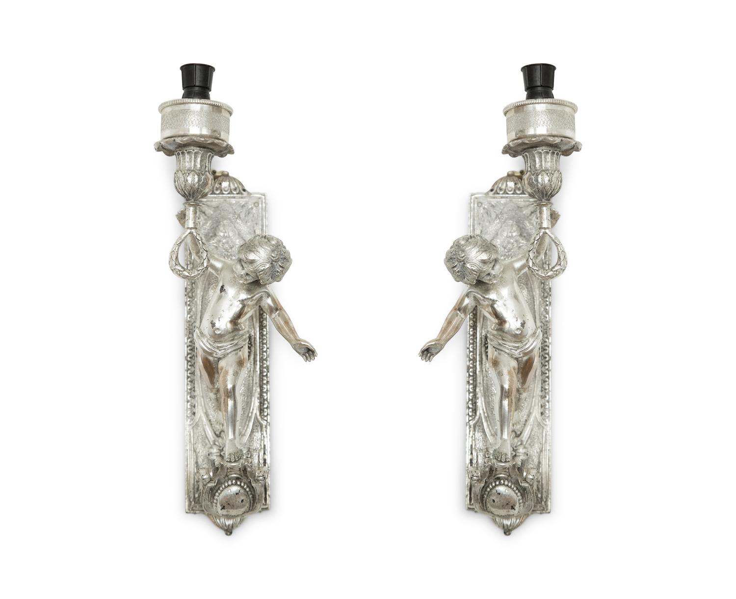 A Pair of Continental Silvered Metal Figural Wall Lights