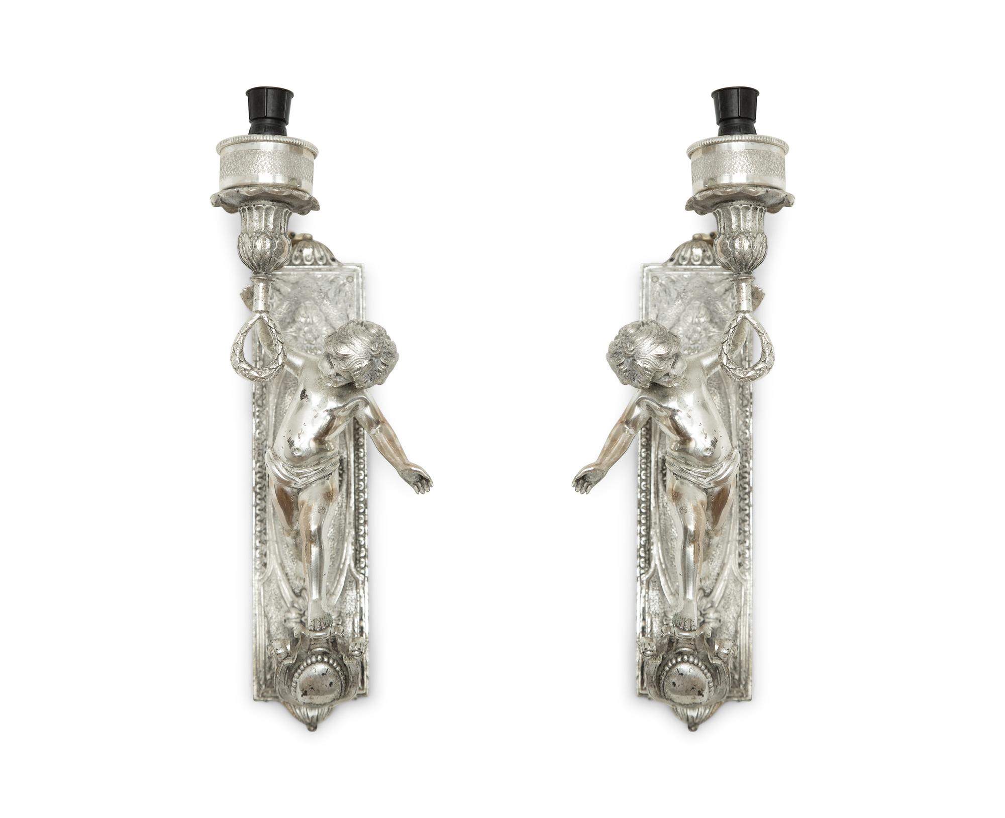 A Pair of Continental Silvered Metal Figural Wall Lights