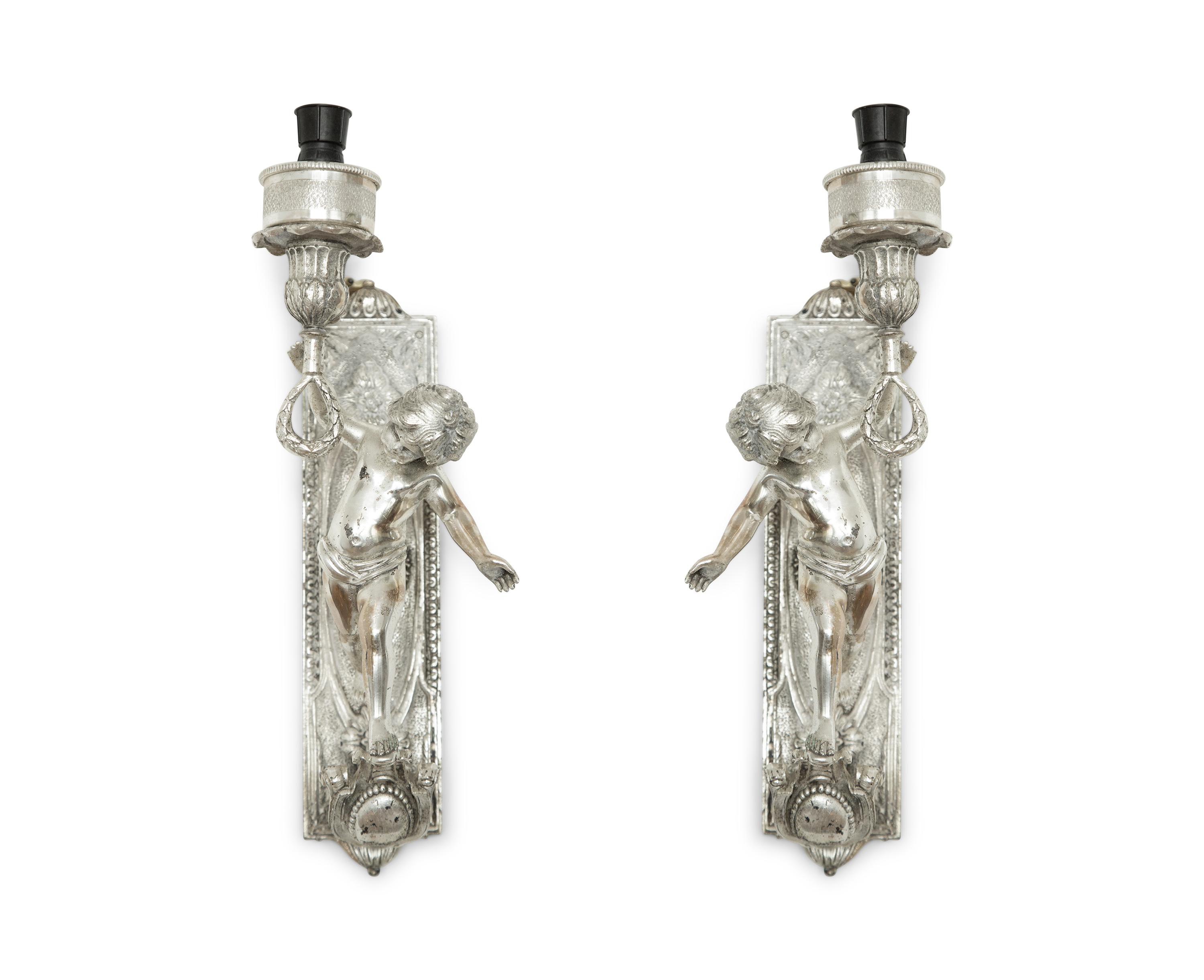A Pair of Continental Silvered Metal Figural Wall Lights