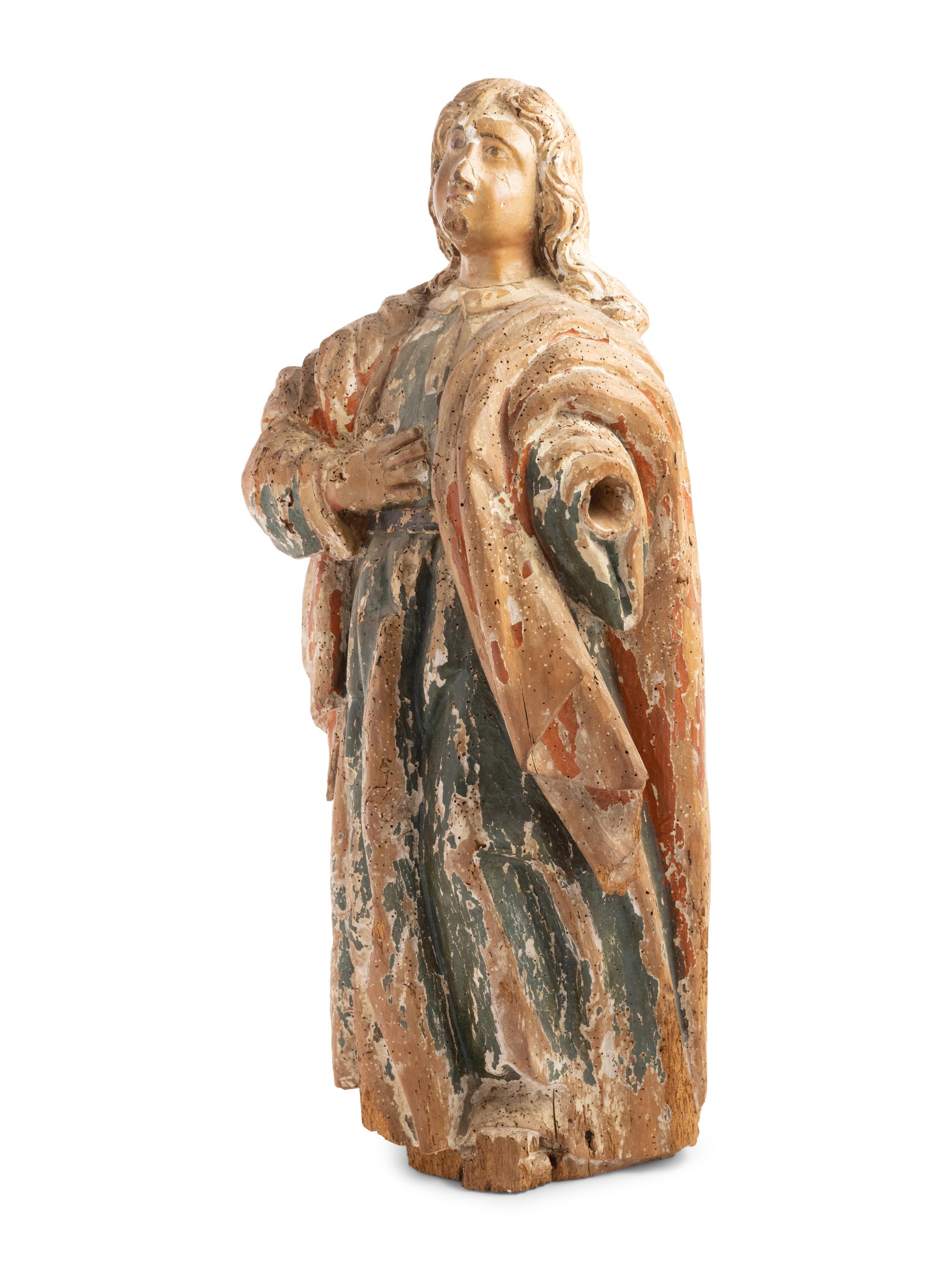 A Continental Carved and Painted Figure of a Saint